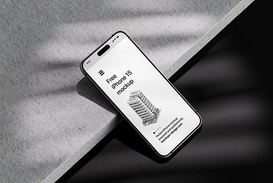 iPhone 15 on dark background mockup